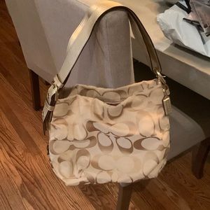Coach tan purse gold strap in good condition no rips tears